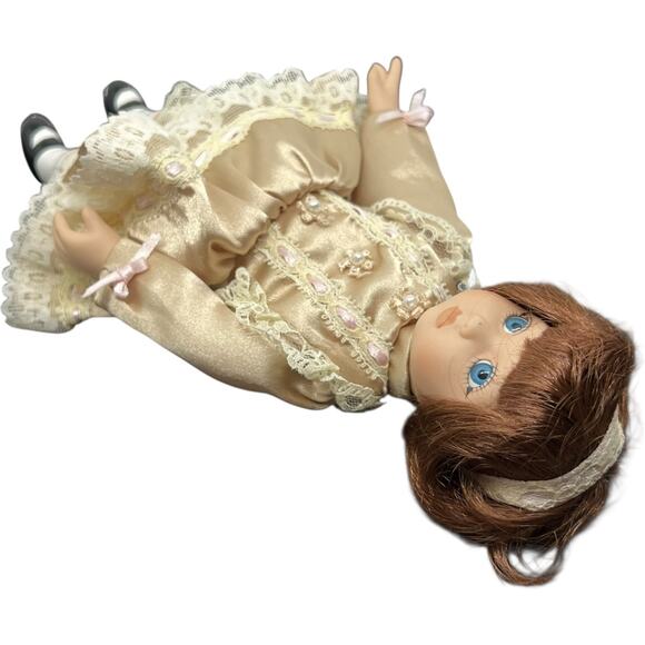 Porcelain Girl Doll in Champagne Satin Dress with Auburn Hair - Picture 6 of 11